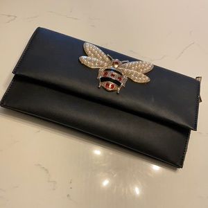 Queen bee jeweled clutch.